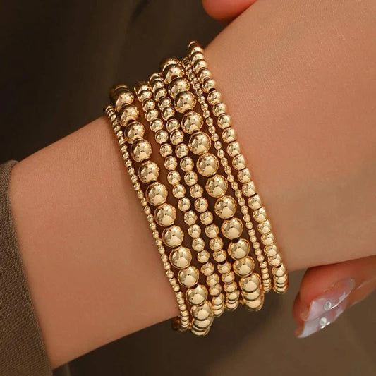 Lot de 7 bracelets empilables dorés avec perles